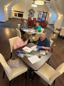 2 couples sitting at tables during the sensory safari ageless and unstoppable event.