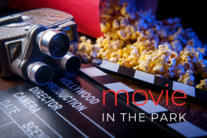 Outdoor movie-themed graphic with a vintage film camera, clapperboard, and popcorn, with the text “Movie in the Par